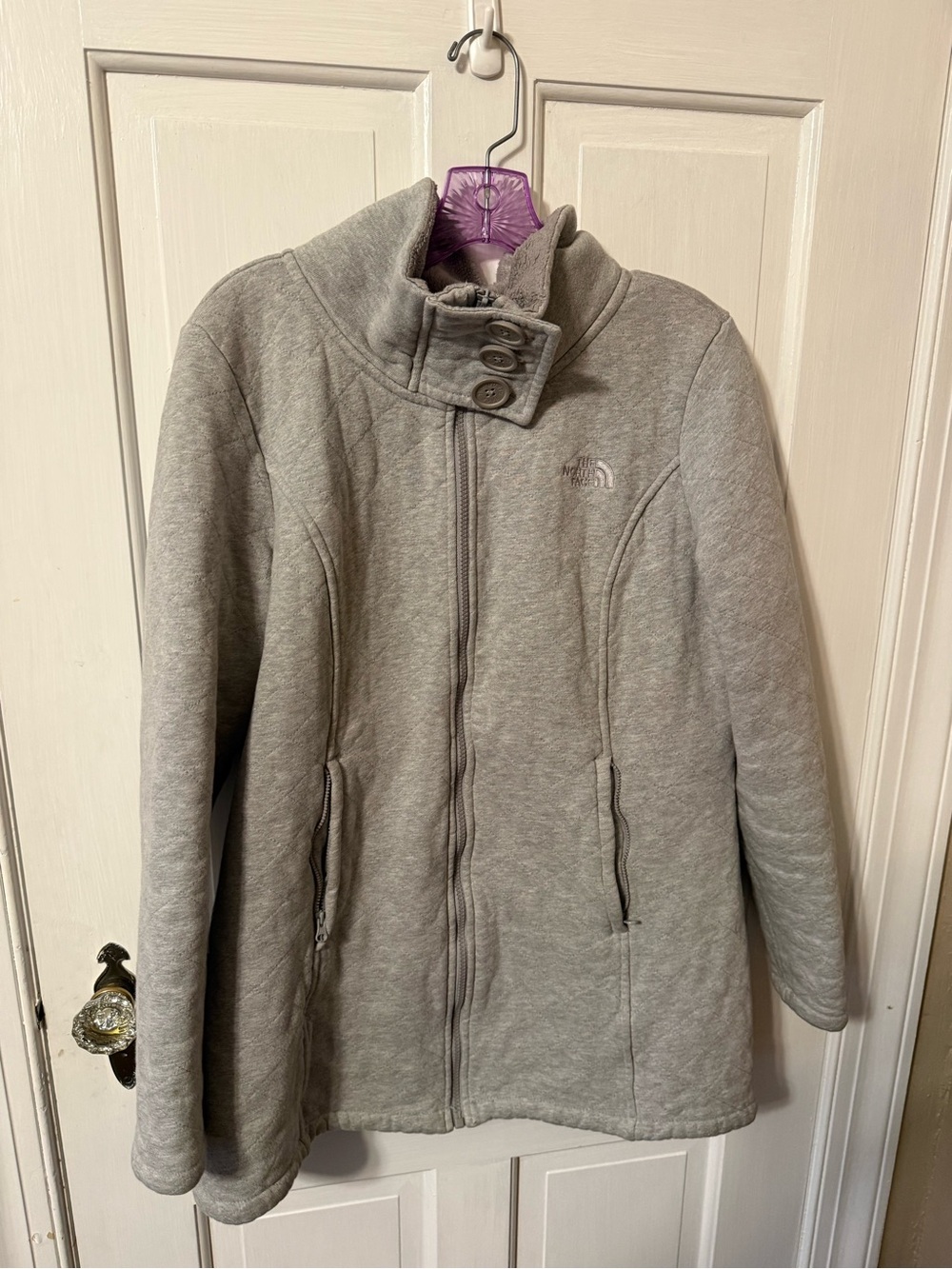 This is a grey The North Face Caroluna quilted fleece-lined jacket.